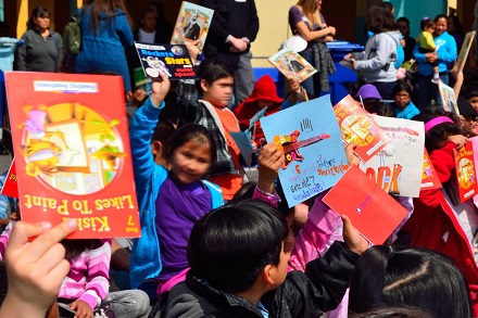 Kids with their prize books after a reading club