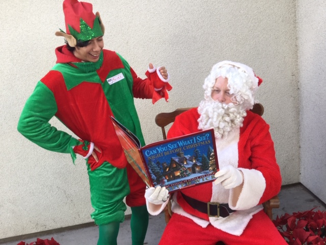 Santa and elf at MacArthur Park reading clubs