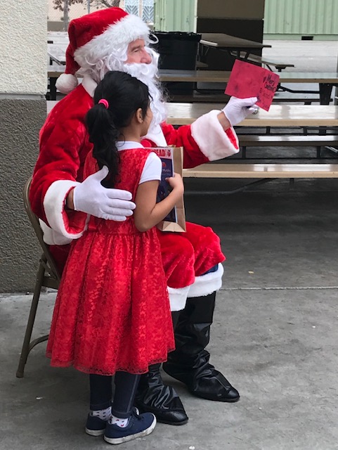Santa and elf at MacArthur Park Elem. reading clubs