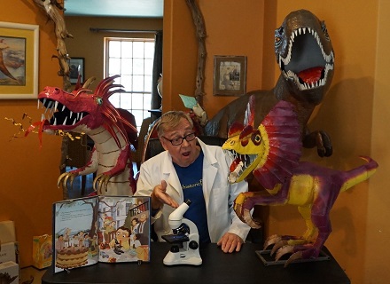 Paul and his dinosaurs ready to read Mario and the Hole in the Sky