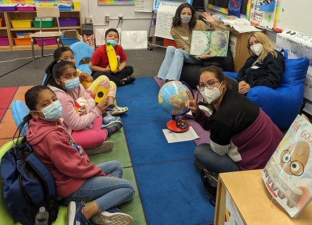 Volunteers and kids at Charles White Elementary