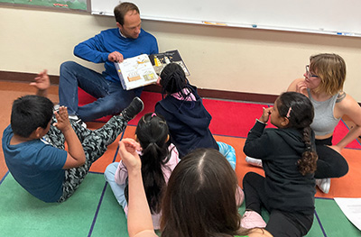 Reading to 1st graders at Charles White Elementary for our Fantasy, Folklore, and Fairytales reading clubs