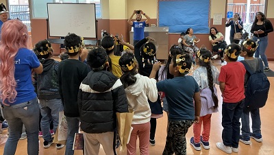 Kids wearing crowns at Charles White Elementary for our Fantasy, Folklore, and Fairytales reading clubs