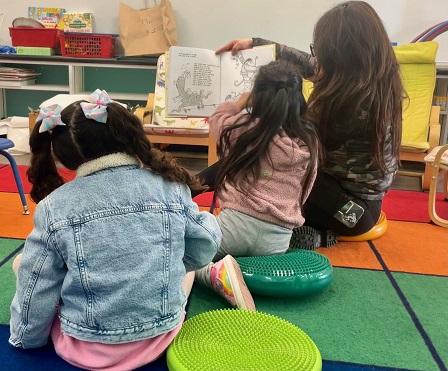 Kindergartners enjoying a book at MacArthur Park Elementary