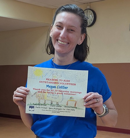 Charles White Elementary Site Coordinator Megan Cottier with her 10th reading clubs certificate