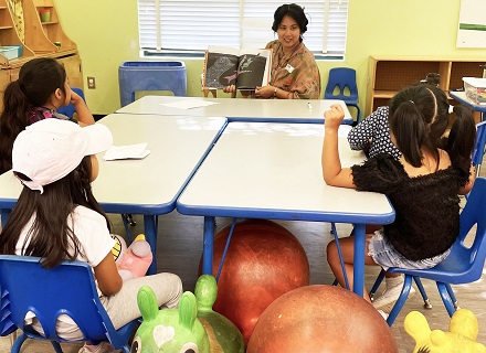 Kindergartens enjoying a book at MacArthur Park Elementary
