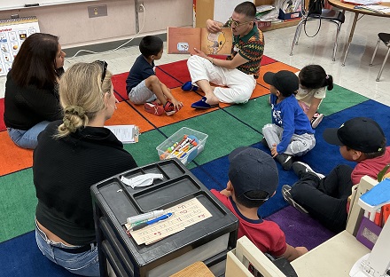 Kindergartners enjoying a book at MacArthur Park Elementary