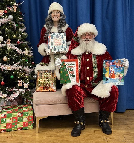 Santa and Mrs. Claus at Alta Loma Elem. with read-aloud books