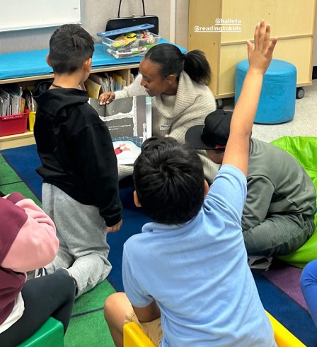 1st graders enjoying a book at the reading clubs