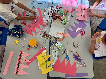Kindergartners creating crowns at MacArthur Park Elementary