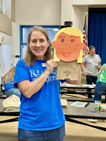 Kindergarten volunteer with her sample craft at MacArthur Park Elementary