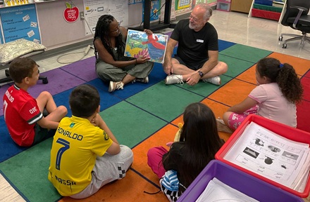 2nd graders enjoying a book at the reading clubs