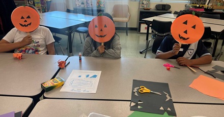 2nd graders enjoying a book at the reading clubs