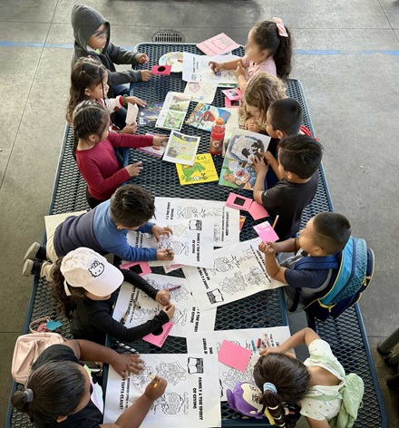 Kindergartners at MacArthur Park Elementary coloring before the reading clubs start