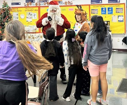 Santa and reindeer at White Elem.