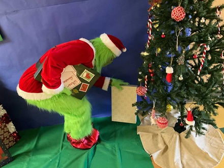 The Grinch trying to steal presents at the Magnolia Elementary reading clubs