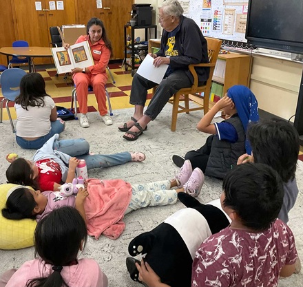 2nd graders enjoying a book at the reading clubs