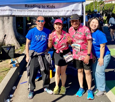 Reading to Kids volunteers and runners at our LA Marathon cheer booth