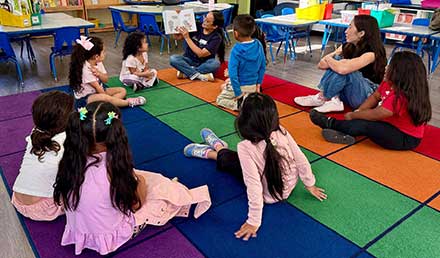 Kindergartners enjoying a book at MacArthur Park Elementary