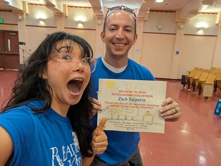 Site Coordinator Zach Halperin receiving his 30th Reading Clubs Milestone Certificate at Charles White Elementary