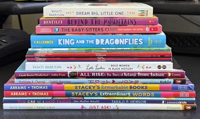Stack of donated prize books at Politi Elementary
