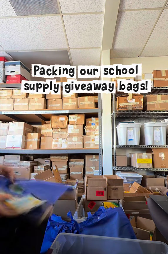 Still from reel video packing school supplies bags