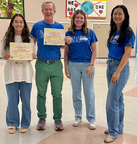 Na'ama Landau and Chris Martin receiving from Site Coordinators Lauren Kuhn and Helen Wu their 20th and 220th reading clubs milestone certificates at Esperanza Elementary