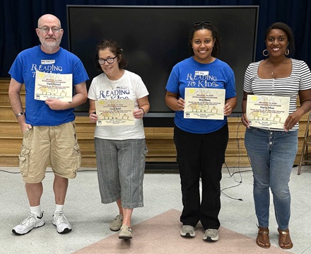 David Rickard, Janet Webb, Nina Maxey, and Kiarra Dikes with their 290th 160th, 50th, and 10th reading clubs milestone certificates at Esperanza Elementary