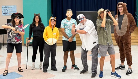 Esperanza Elem. volunteers wearing Halloween costumes